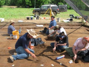 6 Students excavating interior features at Structure 1.