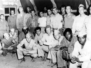 Stressing the need for interracial solidarity in the post-war world, African-American and white soldiers got together as part of the army's general educational program at a heavy bomber base in Italy. March 1945. 