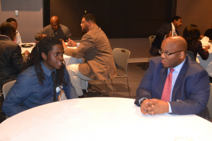 Ed Harper, Hooks Institute Board Member and HAAMI mentor, speaking with a HAAMI student at the 2015 HAAMI reception.