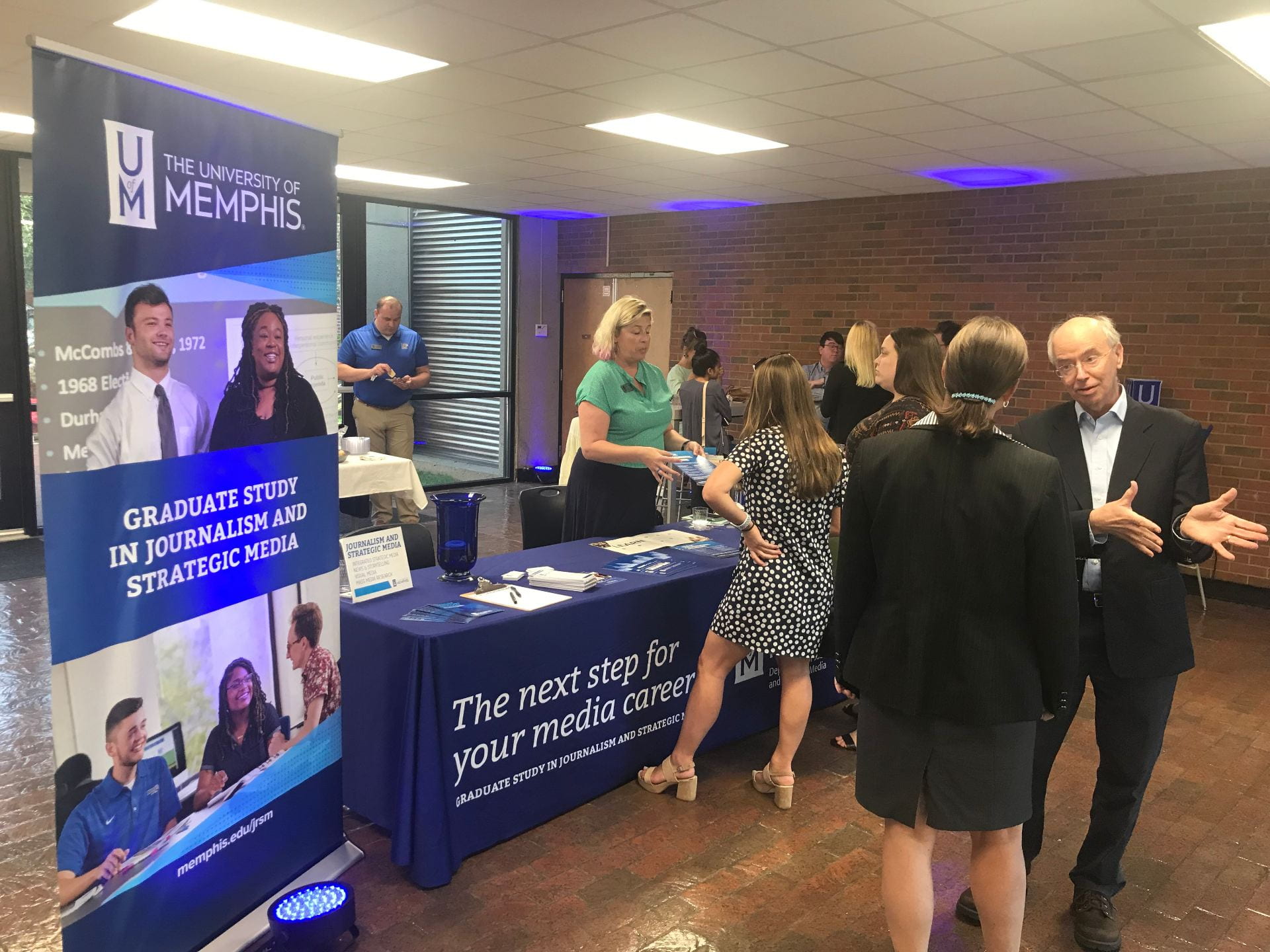 David Arant, chair of Journalism and Strategic Media, discusses graduate programs with UofM Graduate School Dean Robin Poston at an informational open house on July 23 in the Meeman Journalism Building.
